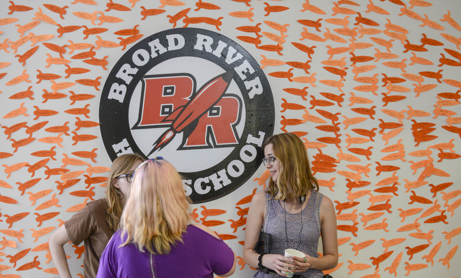 Crew breaking in front of Broad River High School sign